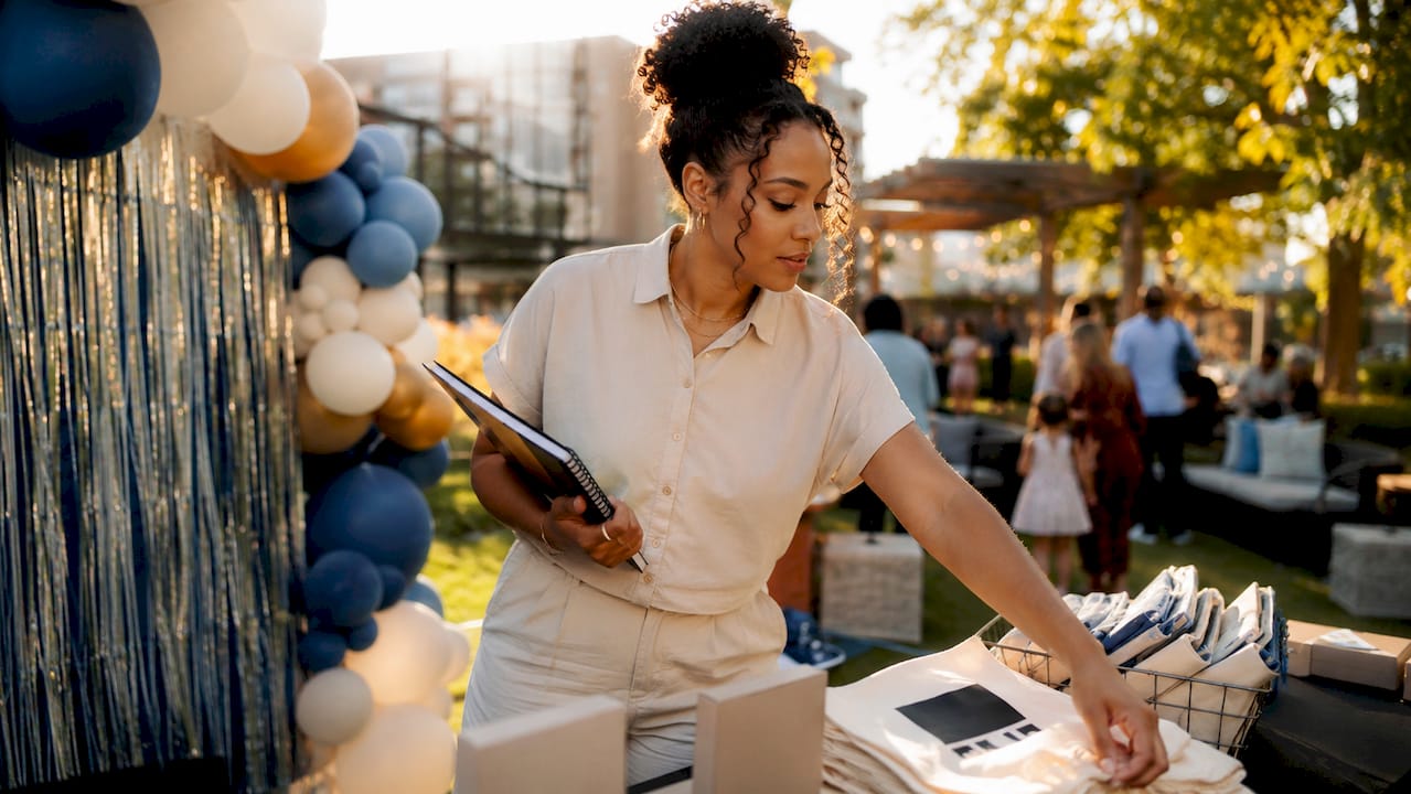 Event coordinator setting up interactive booth