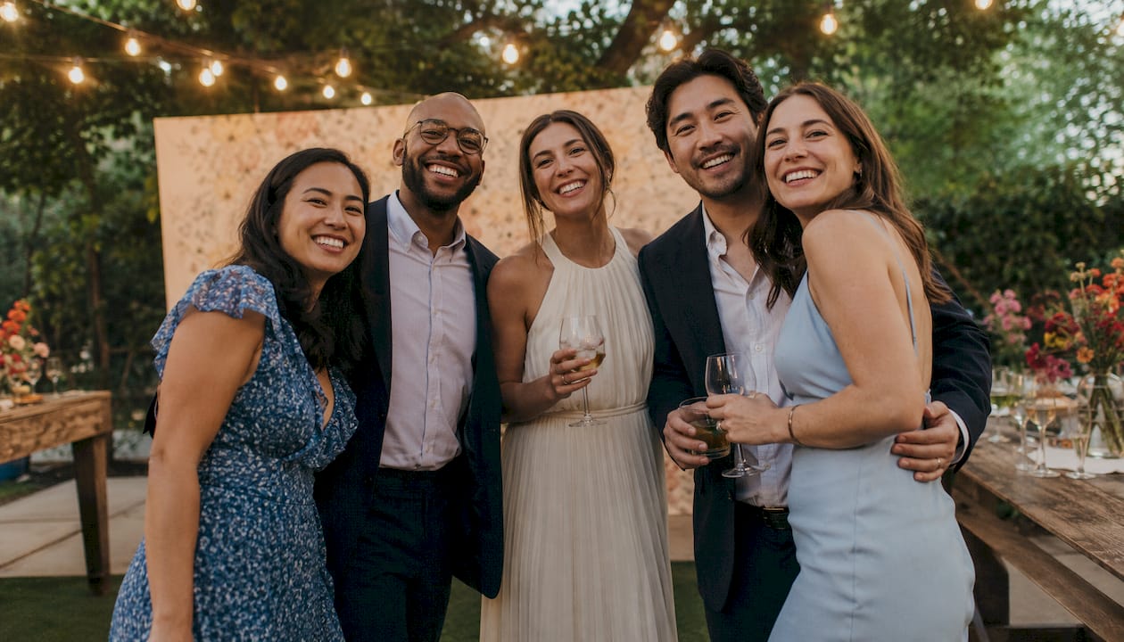 Guests smiling and posing at elegant party
