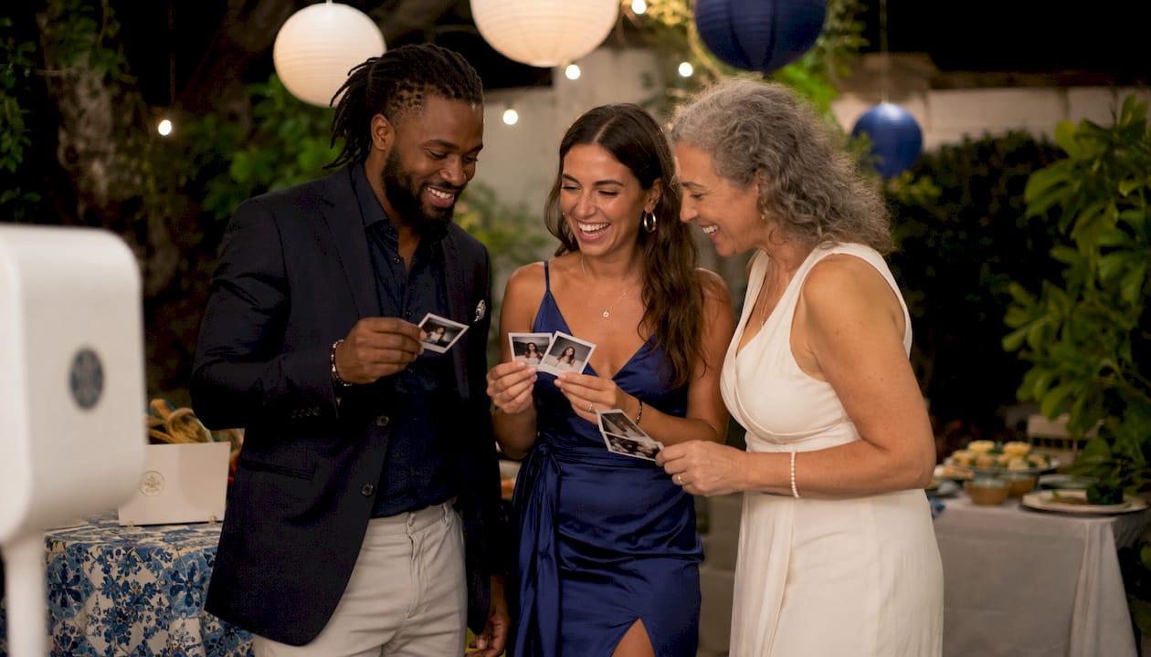 Group of guests sharing instant prints at party