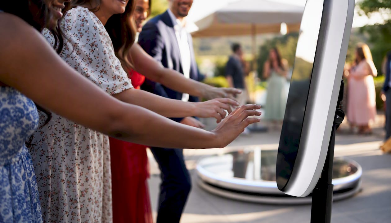Guests engaging with 360 video booth activation panel