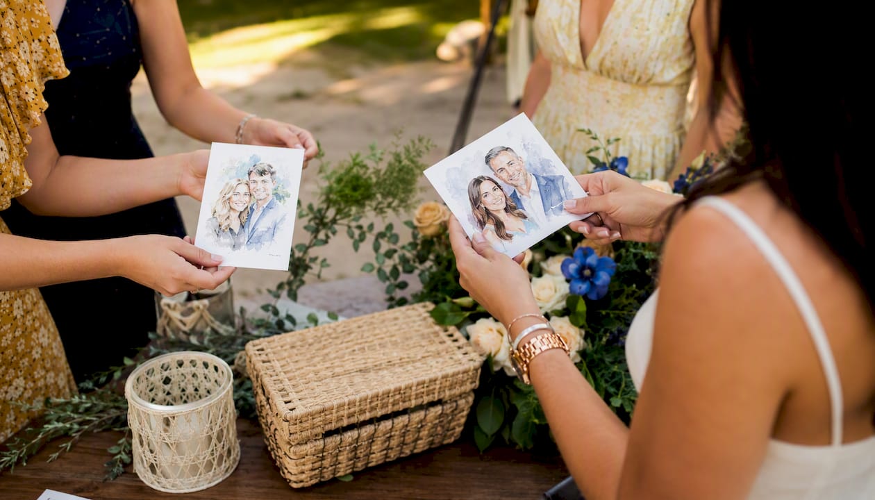 Guests receiving AI watercolor portraits at event